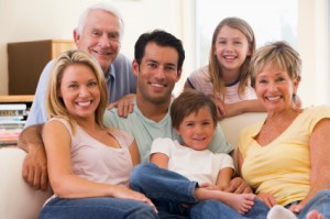 Extended family in living room smiling ready for estate planning
