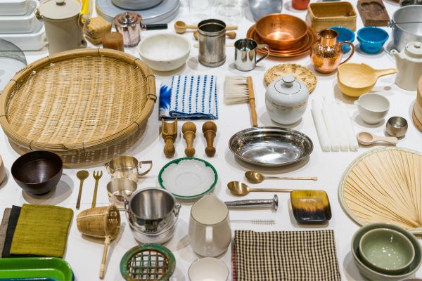An assortment of household belongings including utensils, kitchen implements, and china